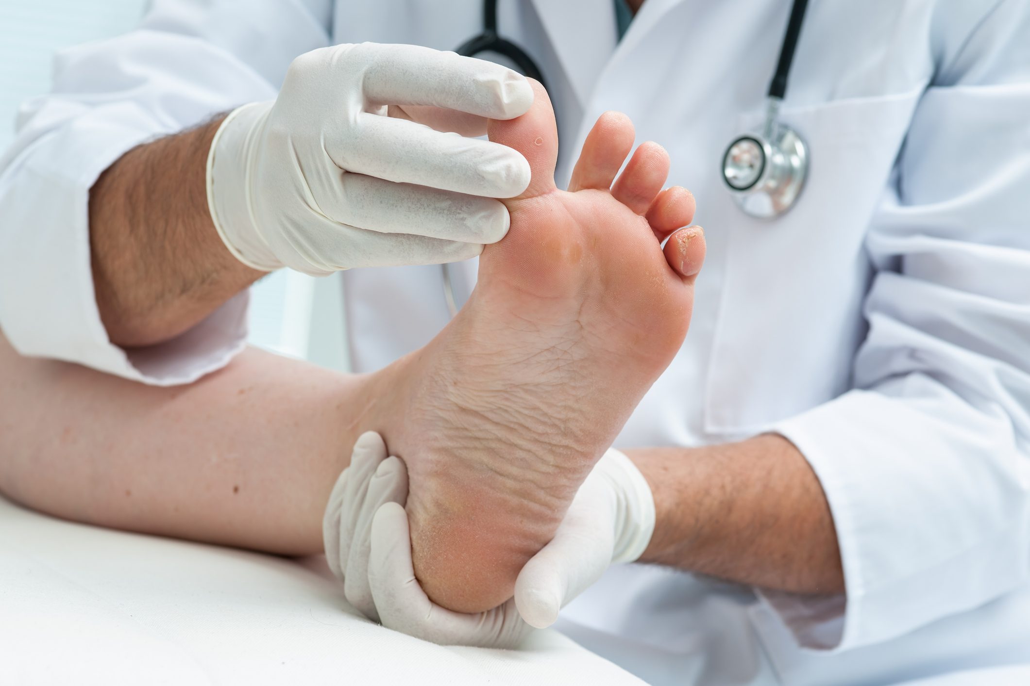 doctor holding patient's foot