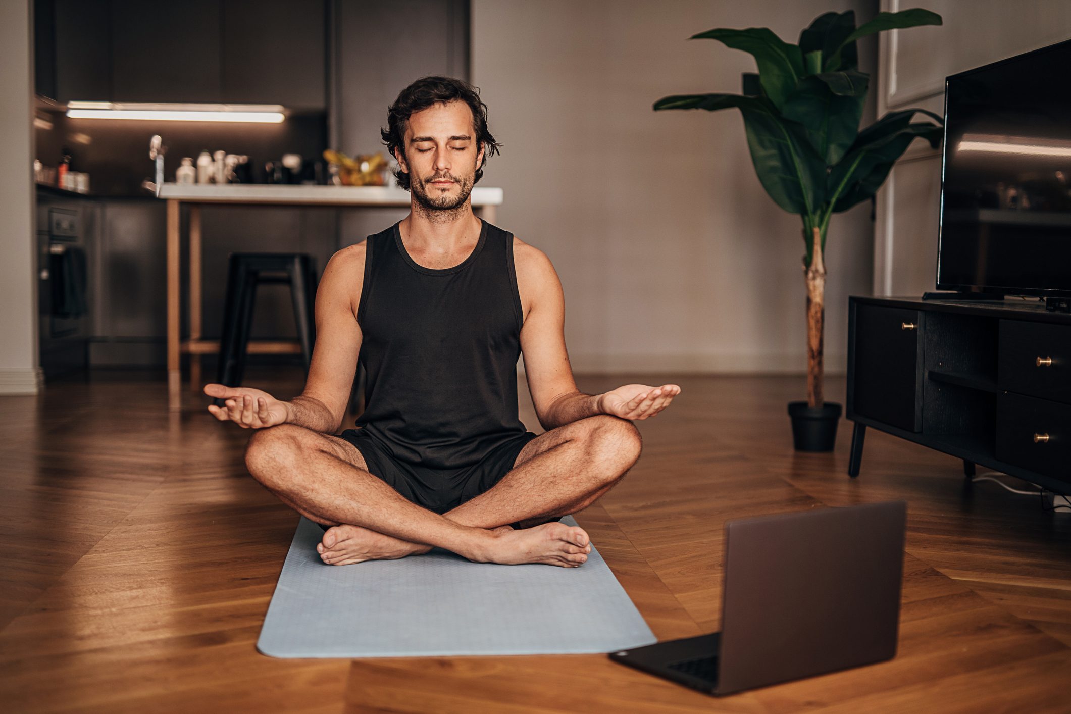 Man meditating in the living room