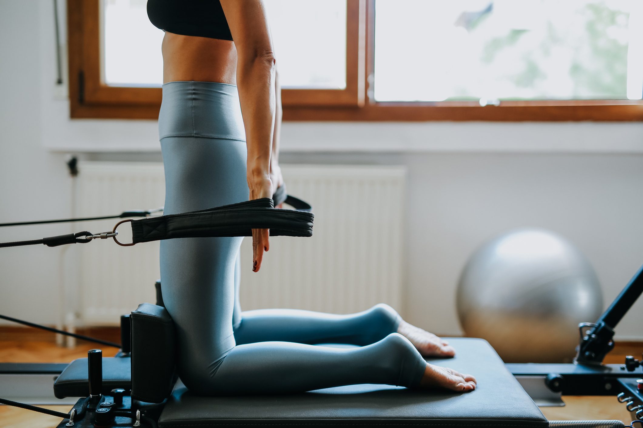 young sporty attractive woman practicing pilates yoga