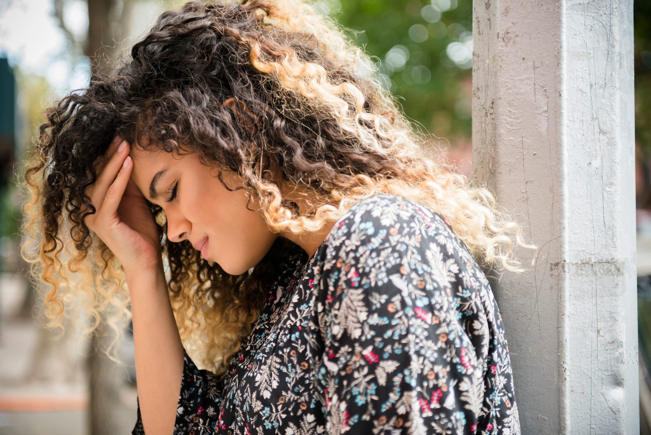 woman rubbing forehead