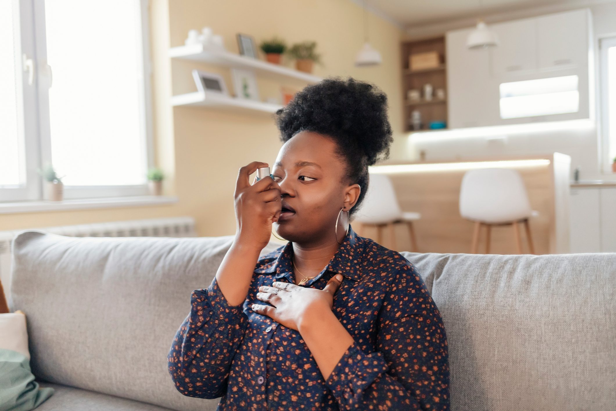 Young Woman With Inhaler Having Asthma Attack, Closeup