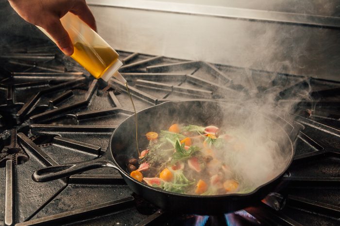 Cropped Hands Making Food In Kitchen At Home
