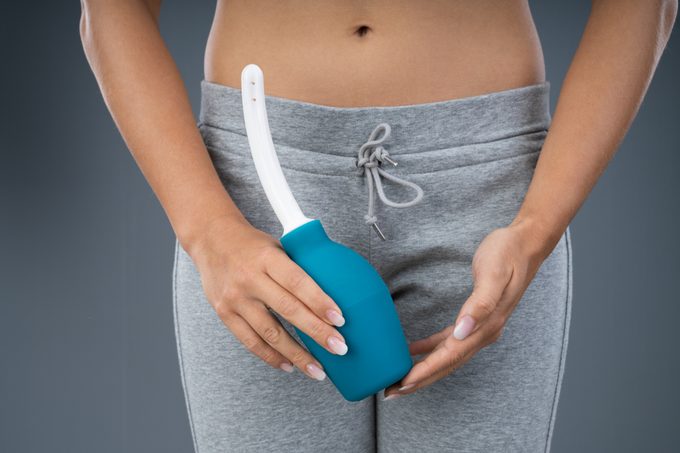 Woman Holding Vaginal Douche
