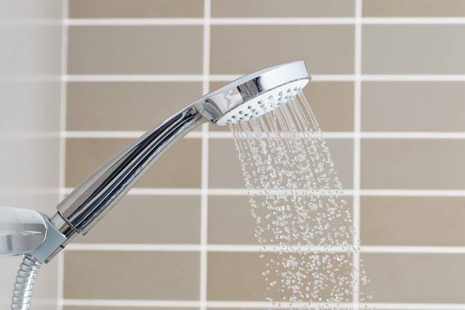 close up of shower head running water