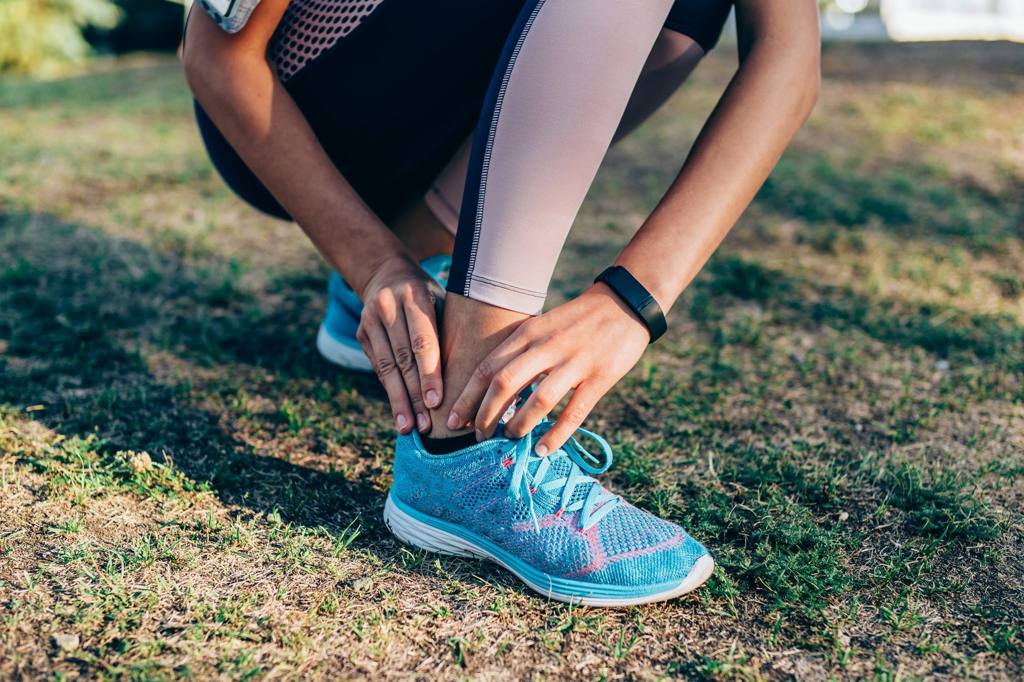 woman experiencing heel pain while walking for exercise