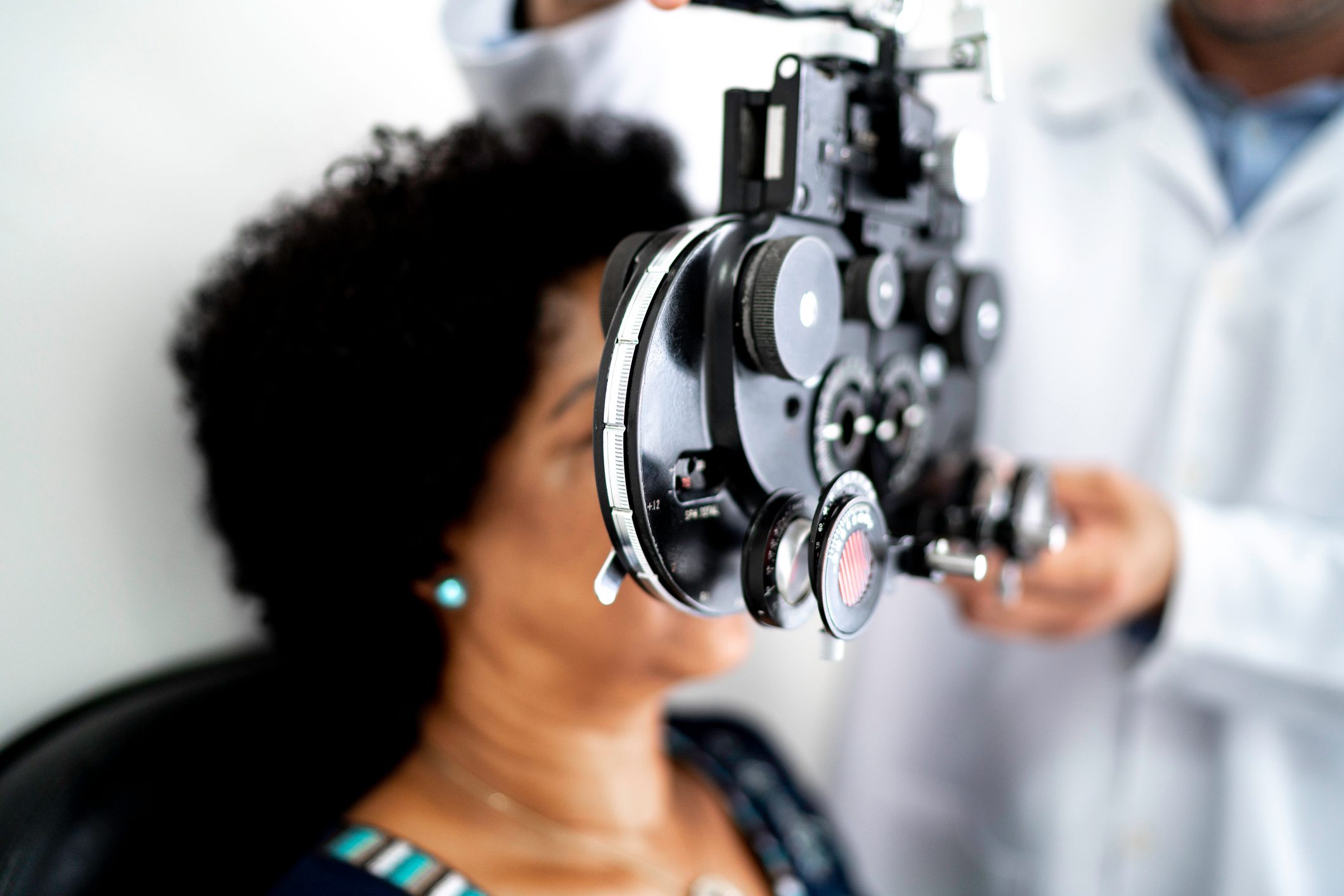 Mature women at a medical appointment with ophthalmologist doctor