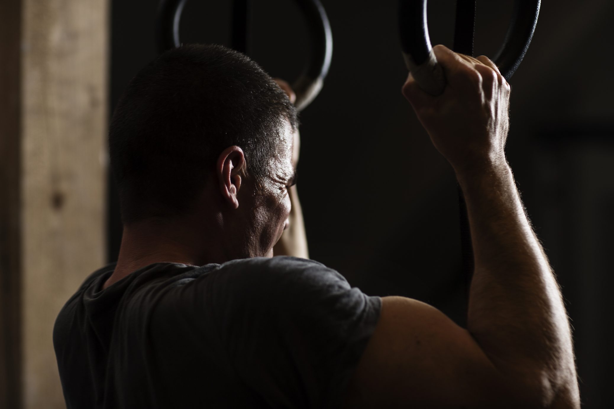 man training in dark gym