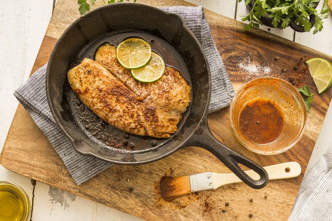 Tilapia on frying pan