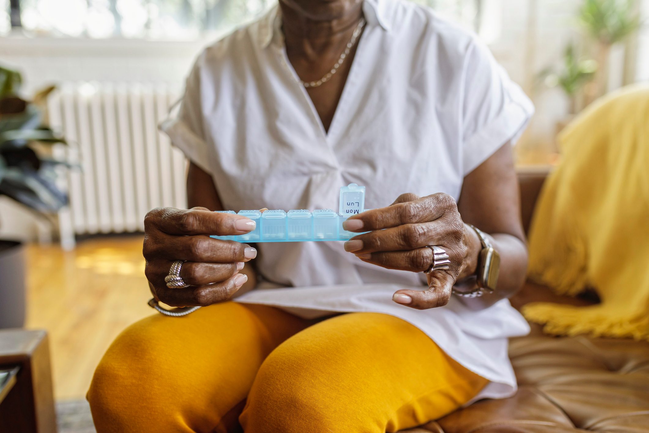 Woman taking daily dosage of medicines