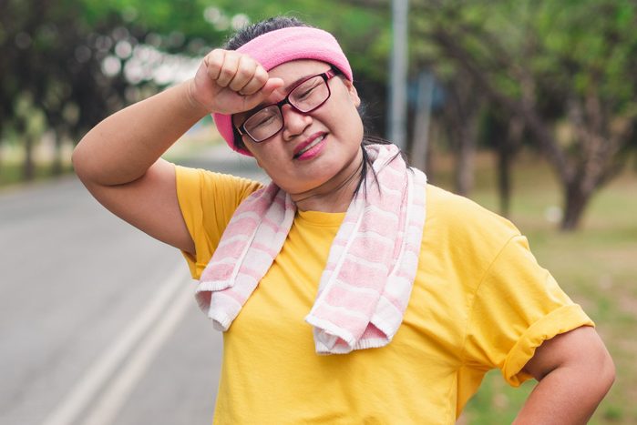 Portrait Of Mature Woman Standing On Road