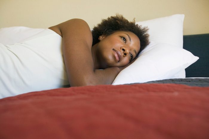 restless woman suffering with insomnia