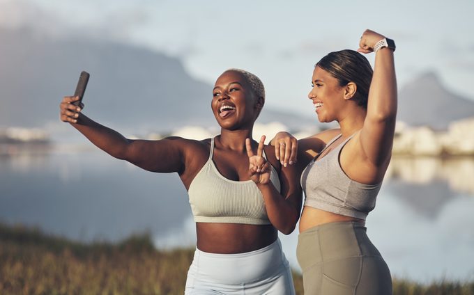 two women taking a selfie while out for a run together