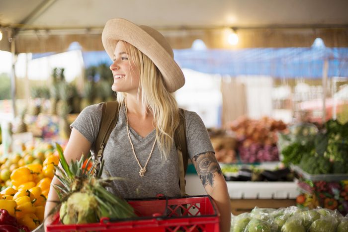 woman shopping at a farmers market