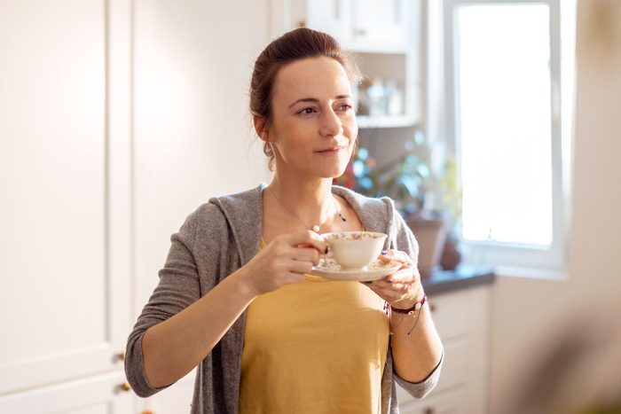 Young woman having a cup of coffee