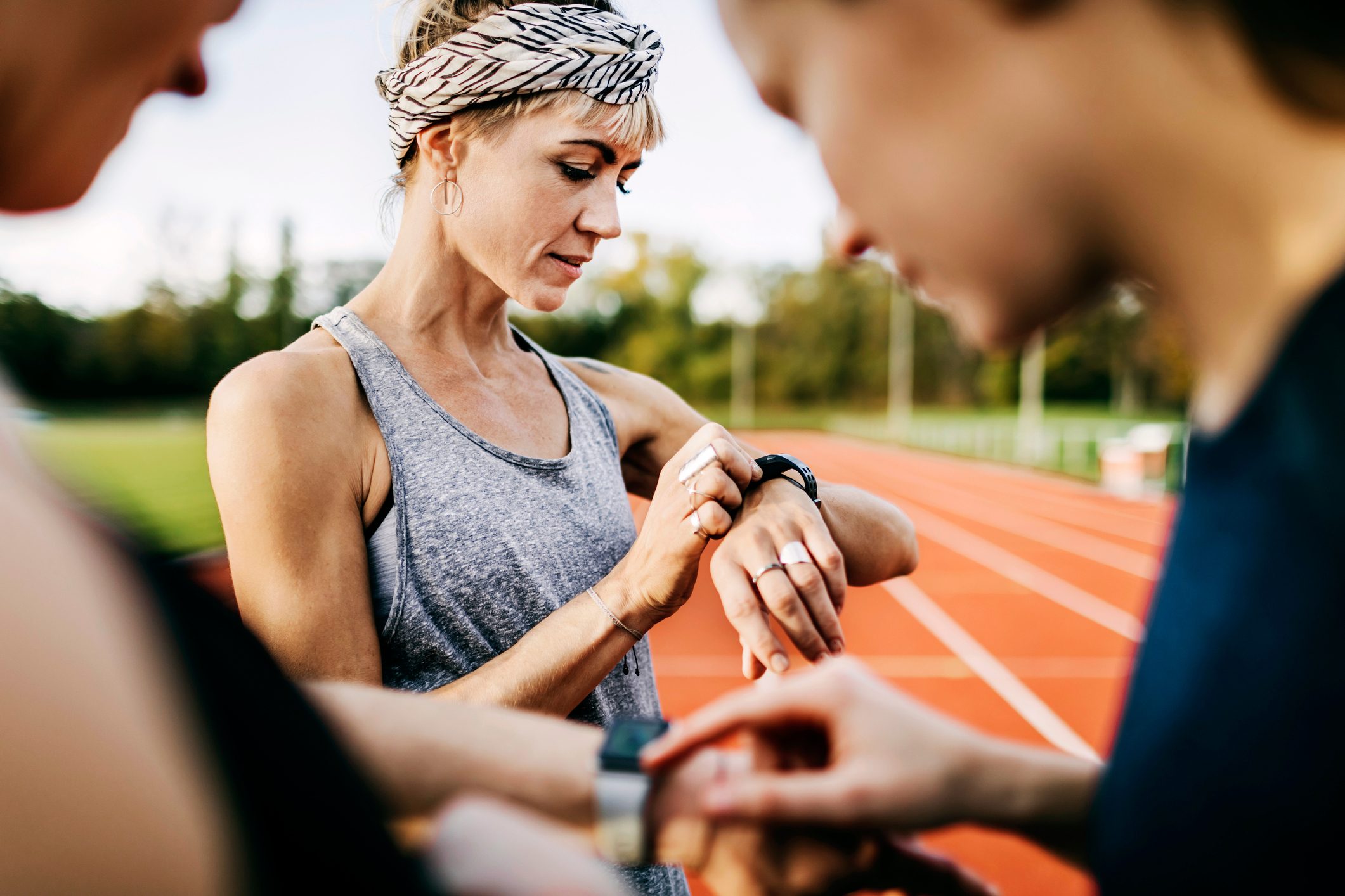 Fitness Enthusiasts Checking Their Times After A Run