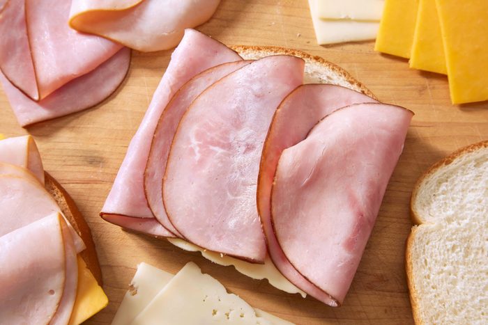 Preparing a Monte Cristo Sandwich, with Black Forest Ham, Smoked Turkey Breast, Cheddar and Swiss Cheese