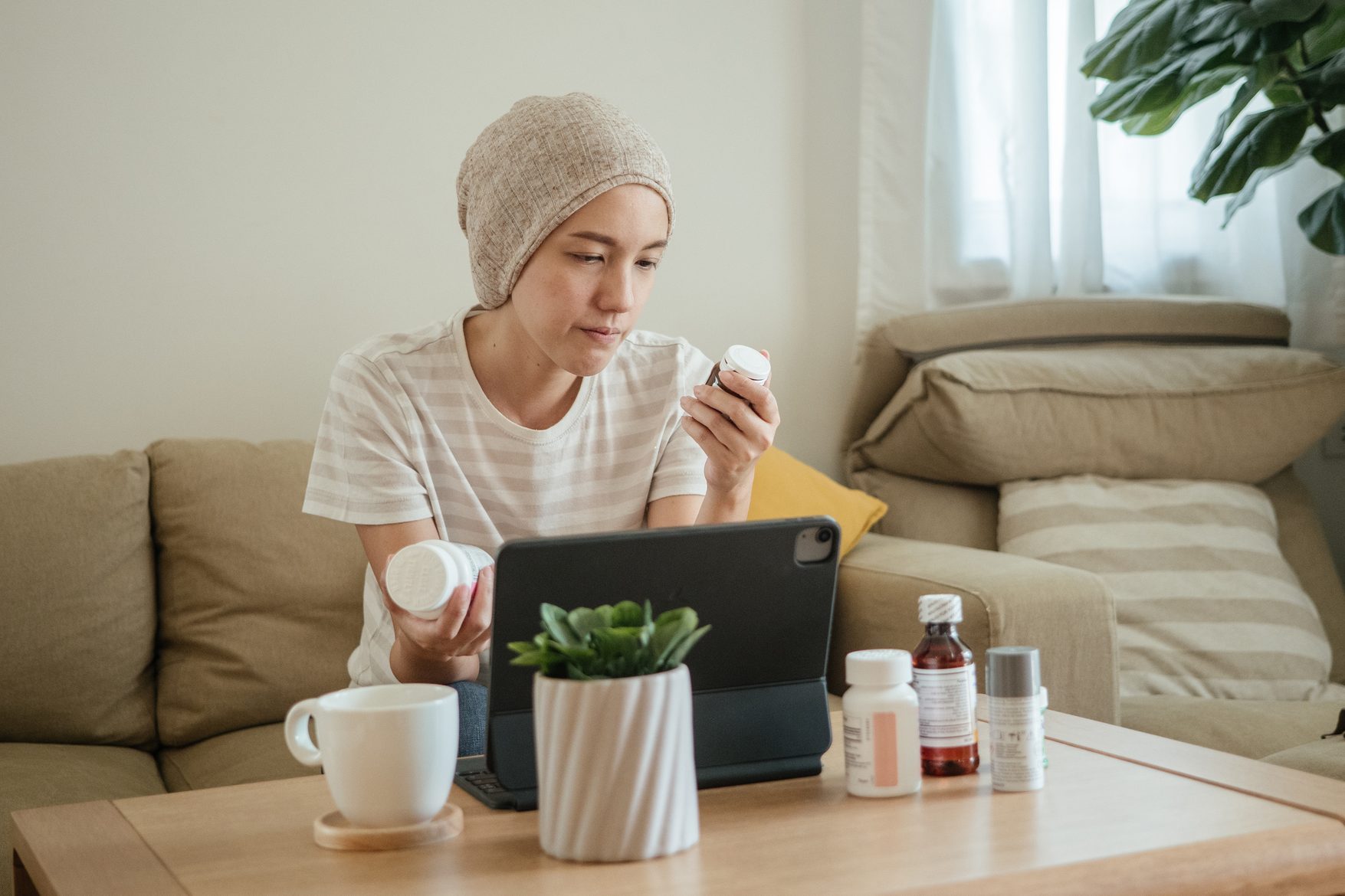 Home healthcare cancer video call with doctor on digital tablet.