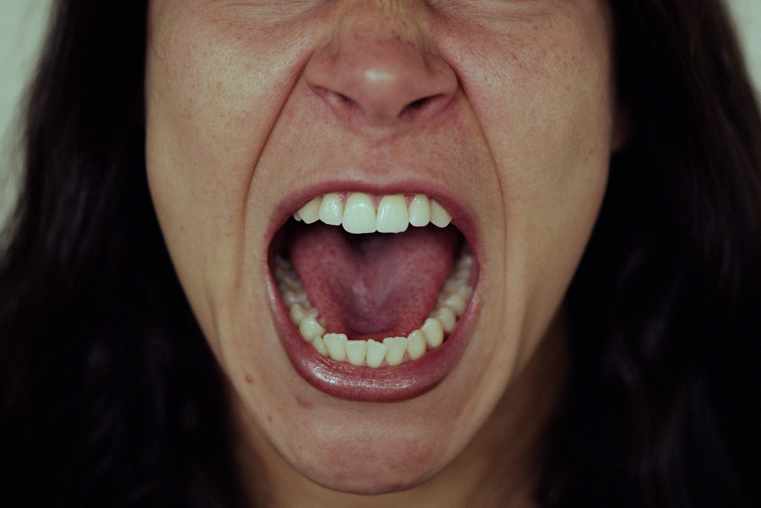 Young woman screaming, close-up