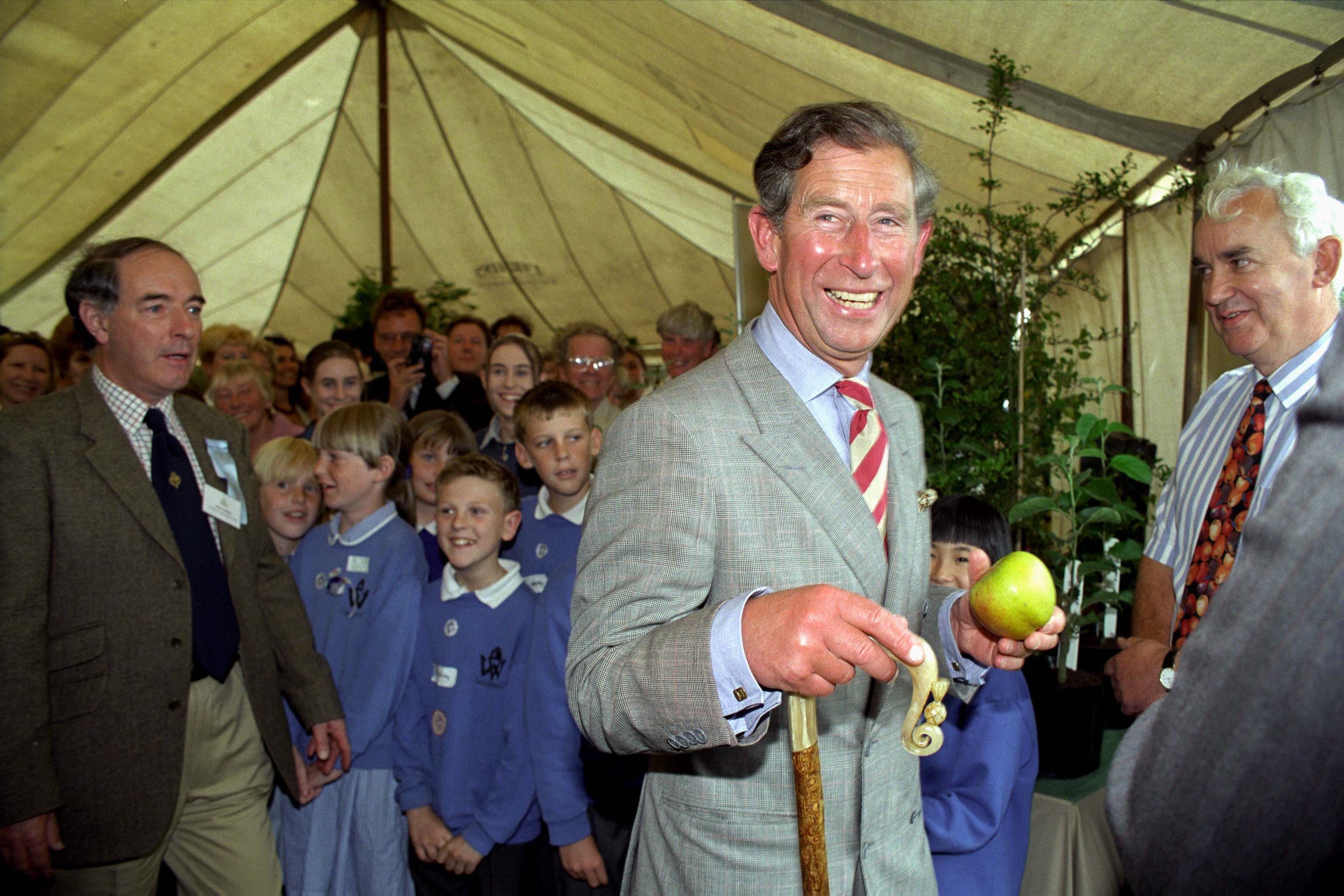 Charles Laughing holding an apple