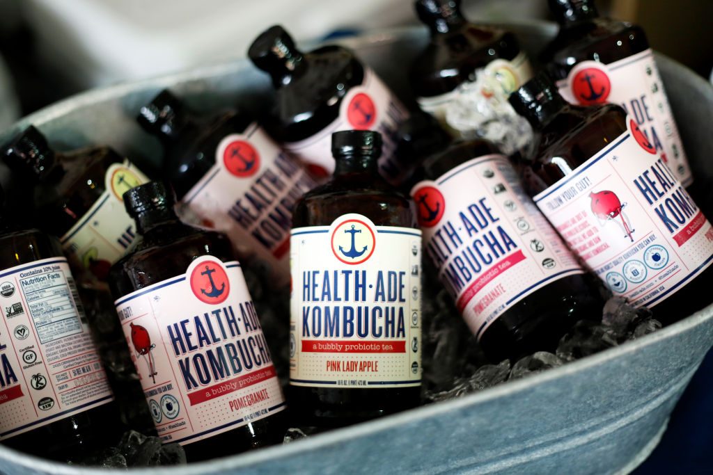 kombucha bottles in an ice tub