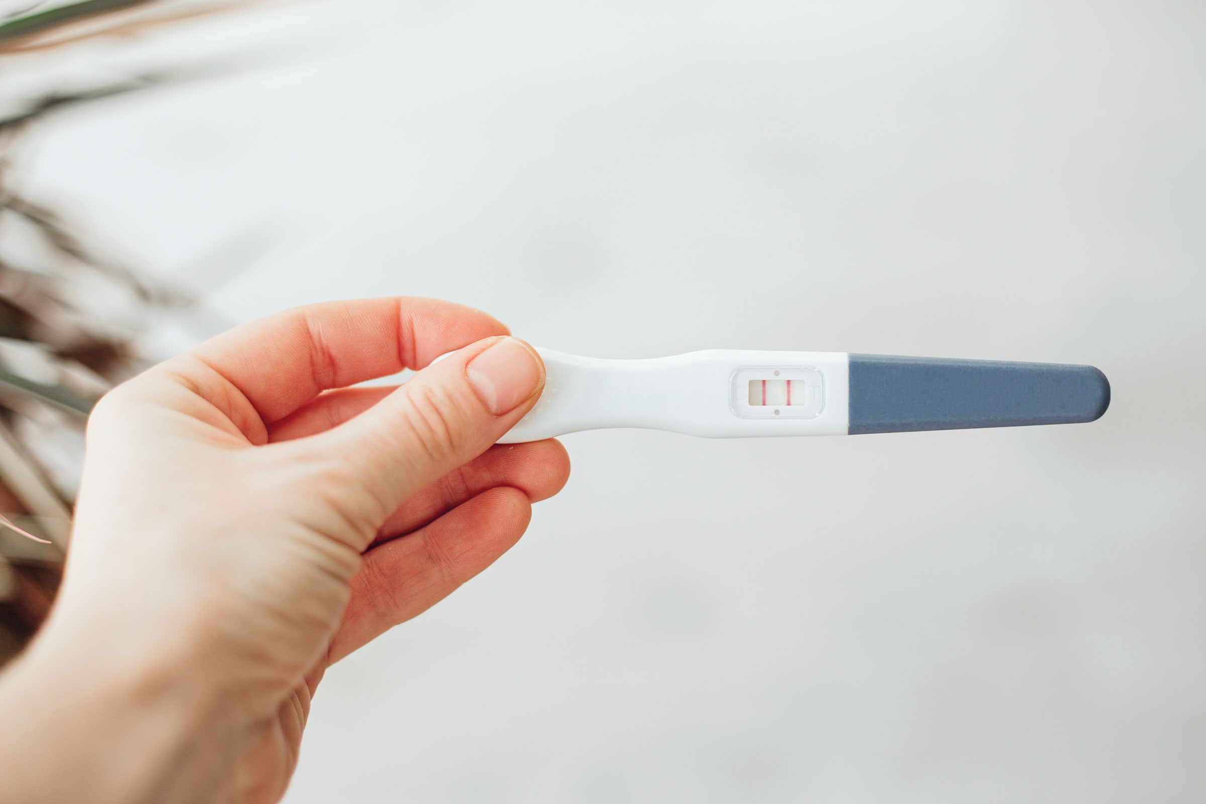 Pregnancy test in woman's hand