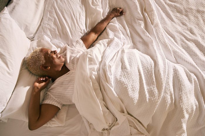 Mature woman in bed (morning)