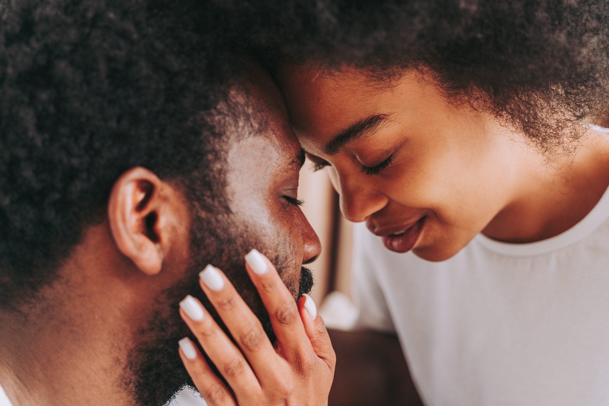 Close-Up Portrait Of Couple Kissing