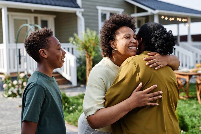 Woman Welcoming Family