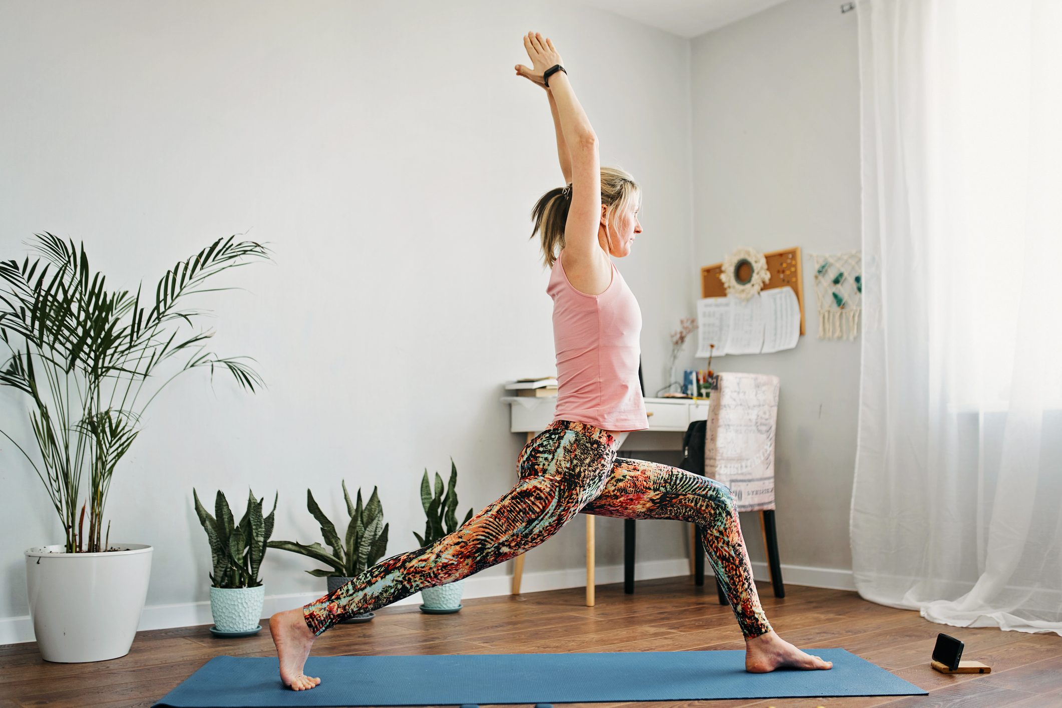 A woman doing yoga at home