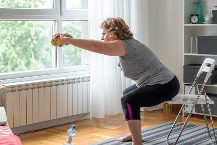 Senior women exercise at home