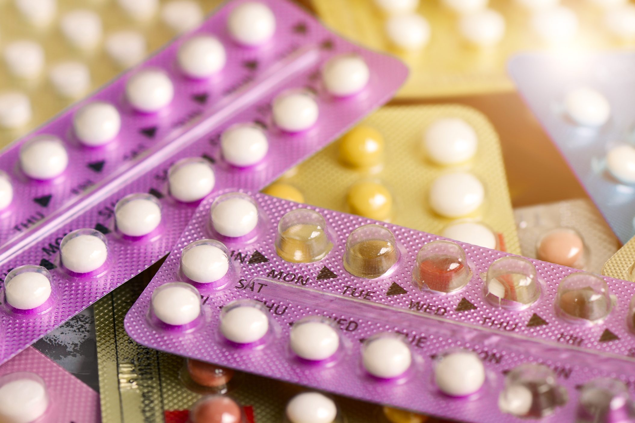 Oral contraceptive pill on pharmacy counter.