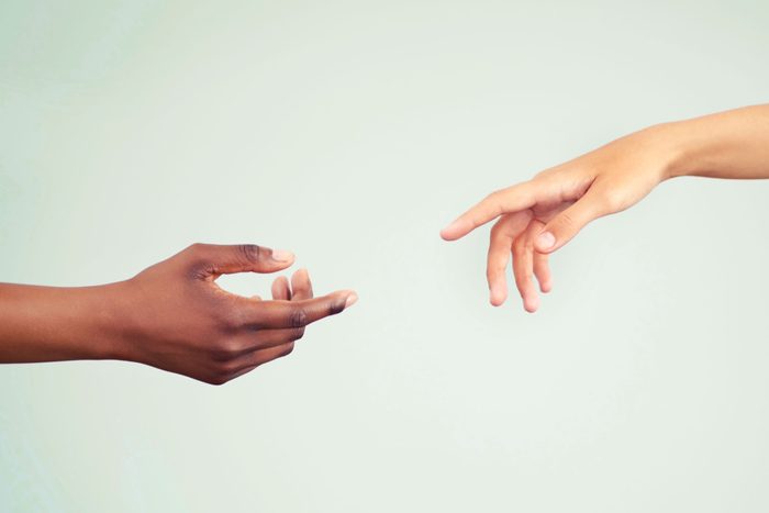 hand reaching for another hand