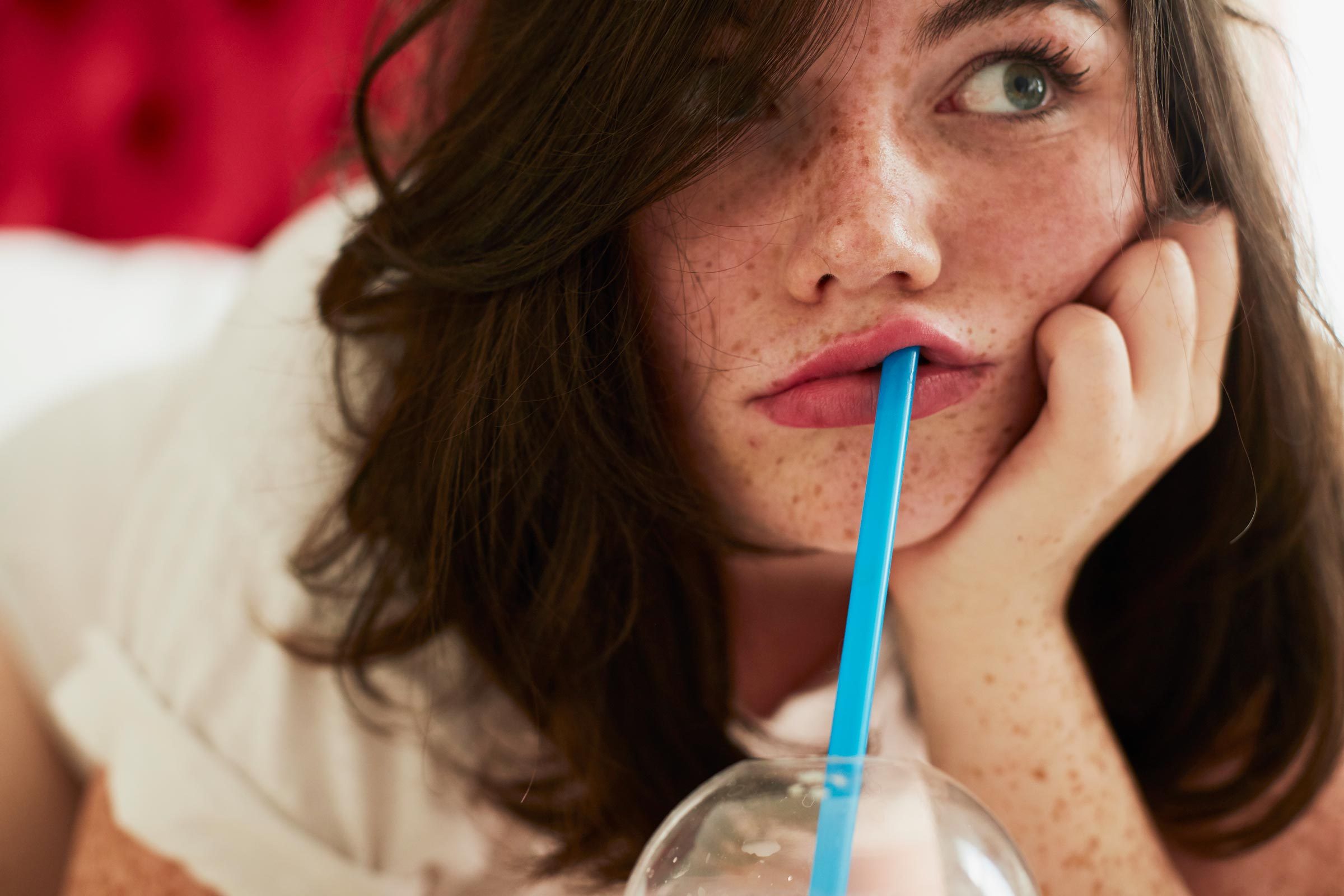 Girl Drinking From Straw