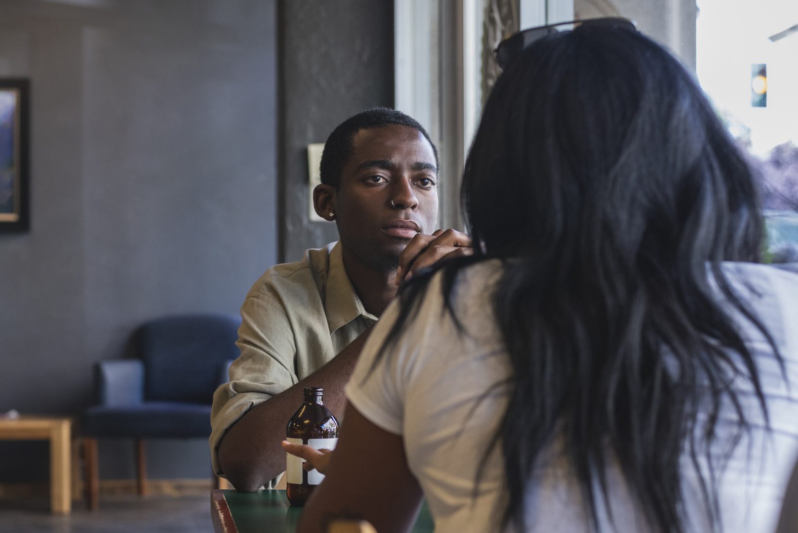 Two people having discussion in cafe