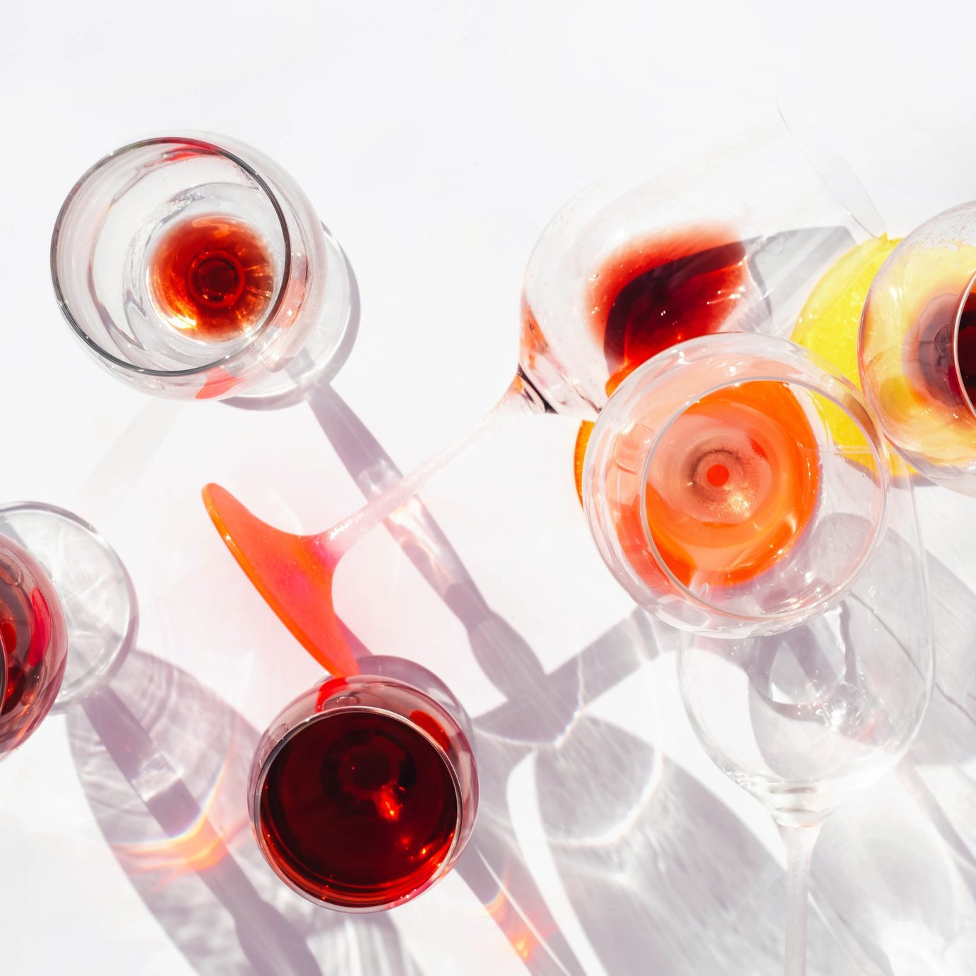 Wine of different varieties in glasses on a white background.