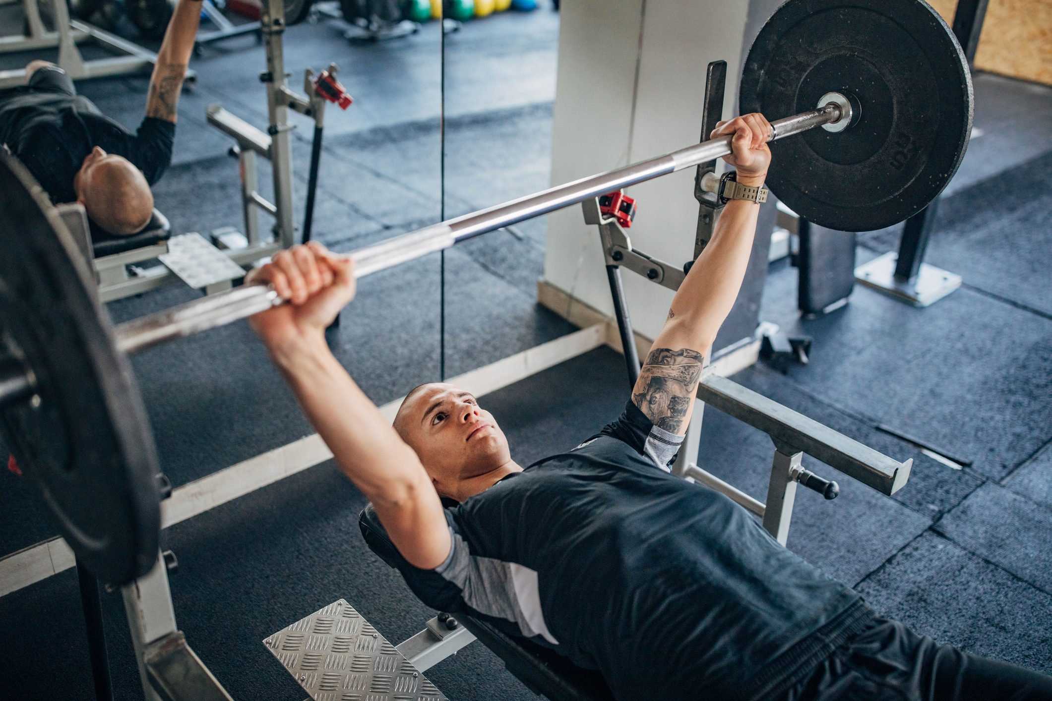 Man training on bench press