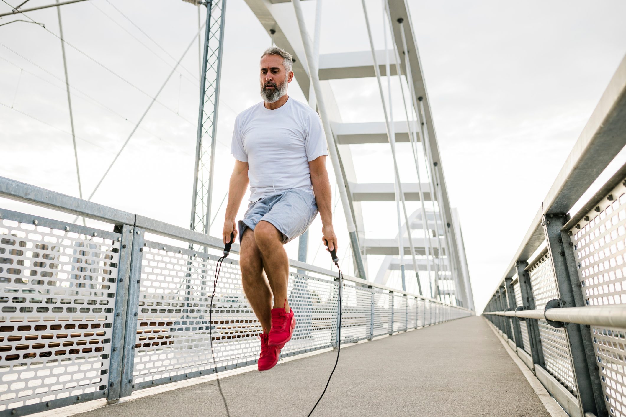 mature man jumping rope during workout