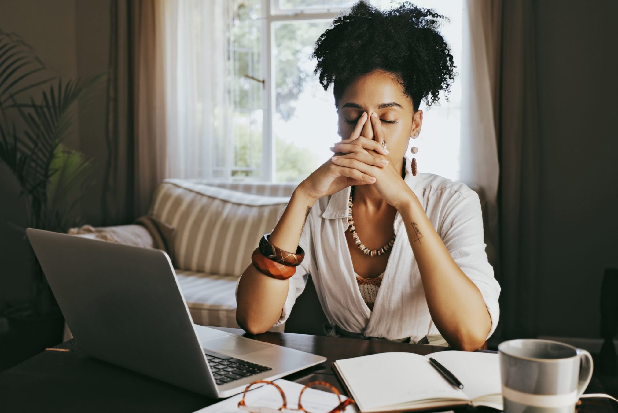 Stress, headache and work from home woman planning, writing and creative research for mental health problem. Laptop, digital person and writer fatigue, burnout or frustrated for online startup budget