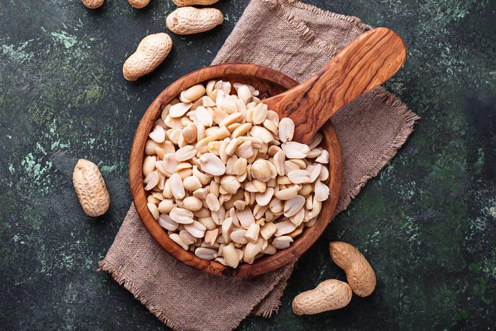 Raw peeled peanuts on bowl