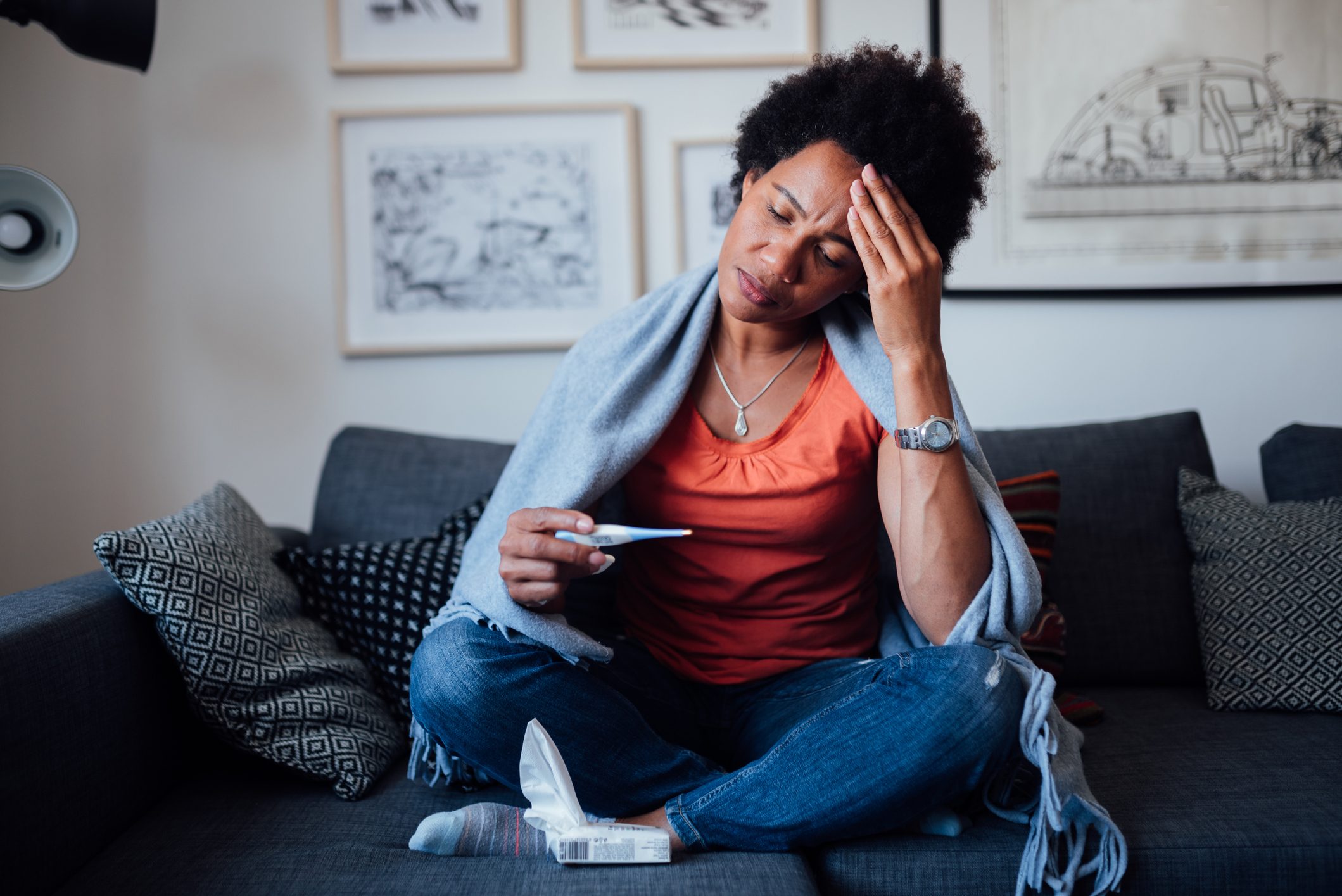 Young woman feeling symptoms of an illness