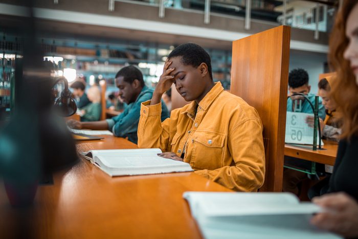 Students in a library reading