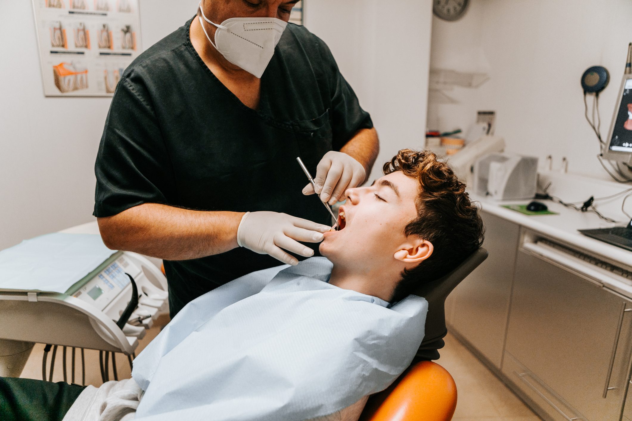 checking the teeth at the dentist office