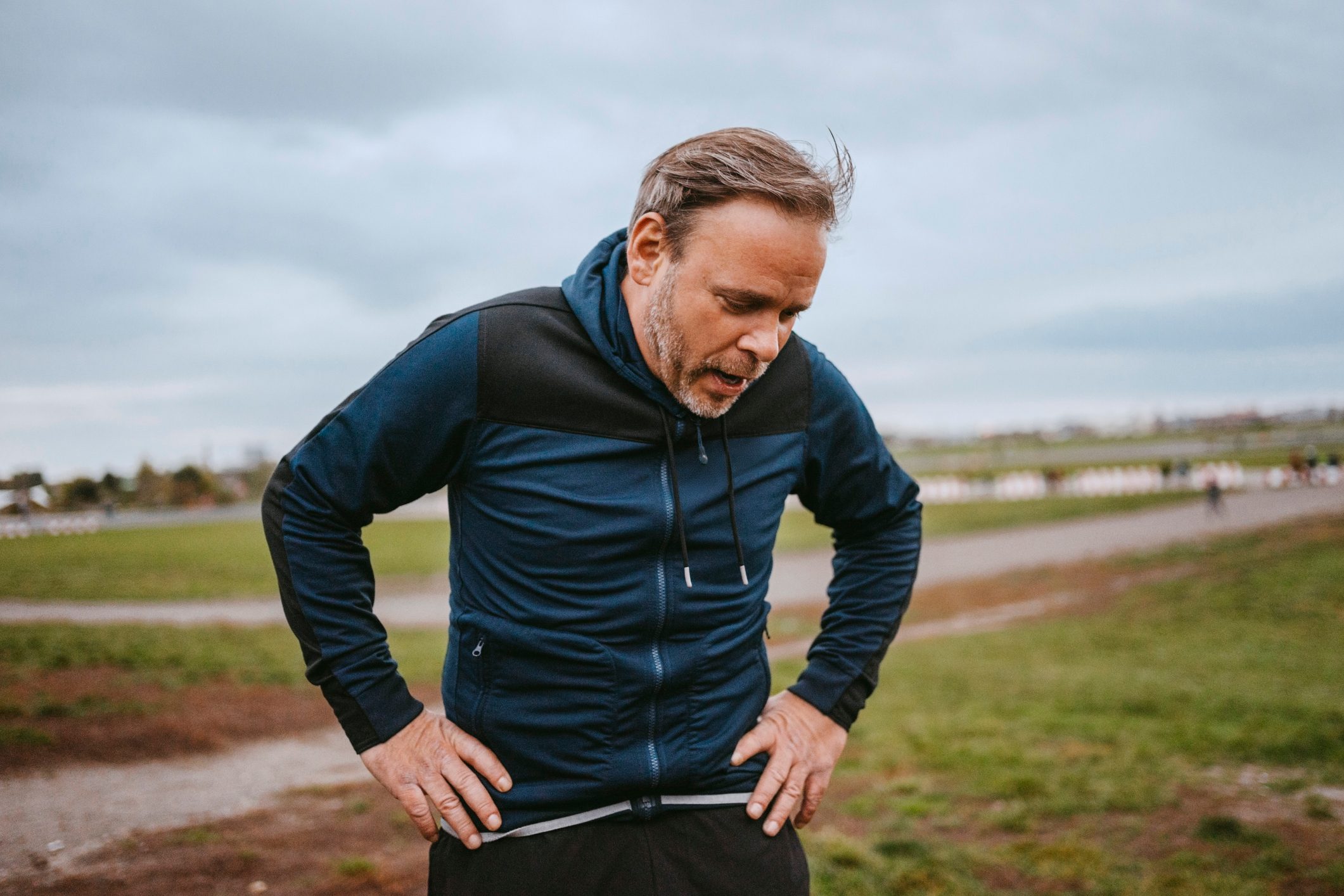 Exhausted man taking break in park