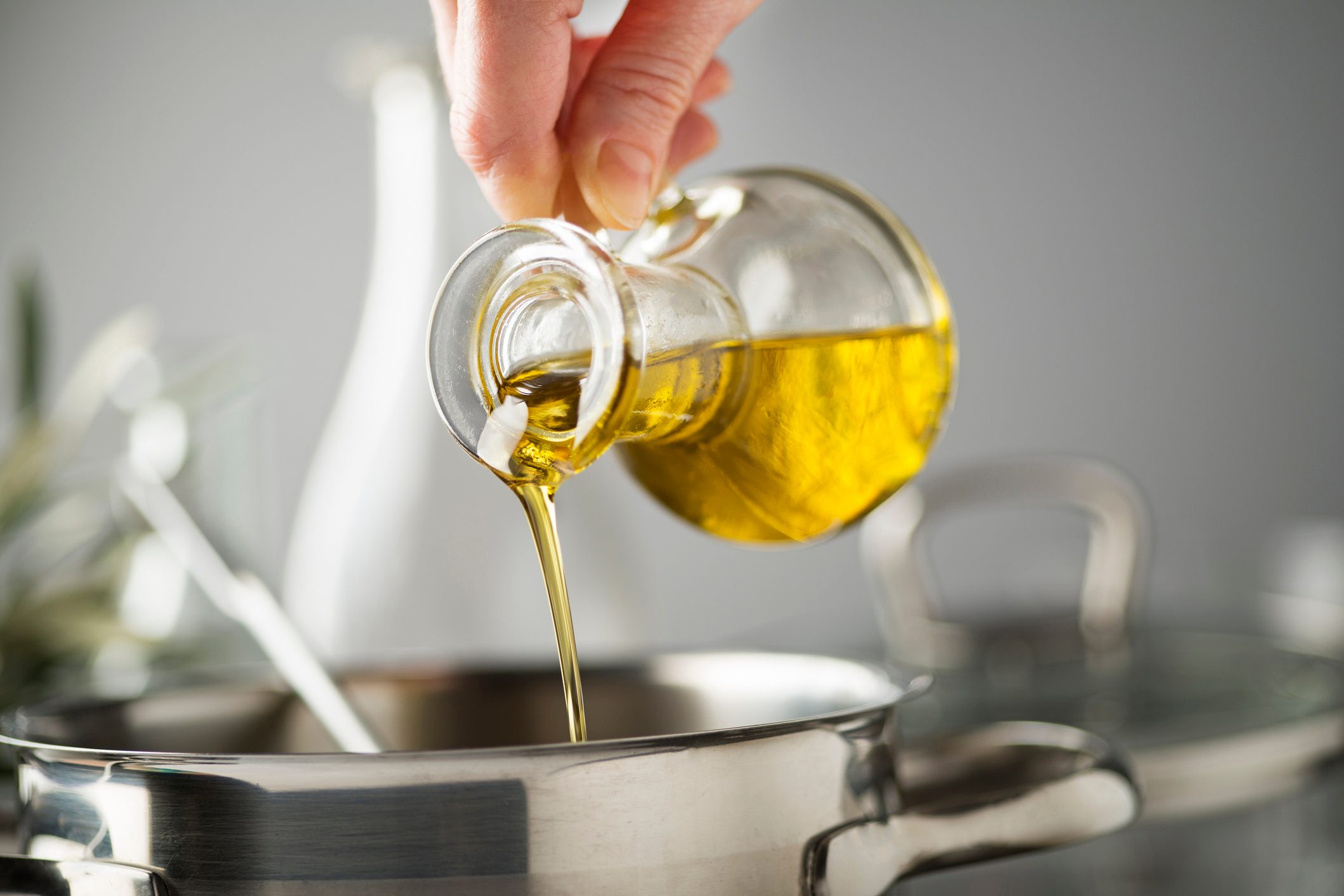 Cooking meal in a pot with olive oil