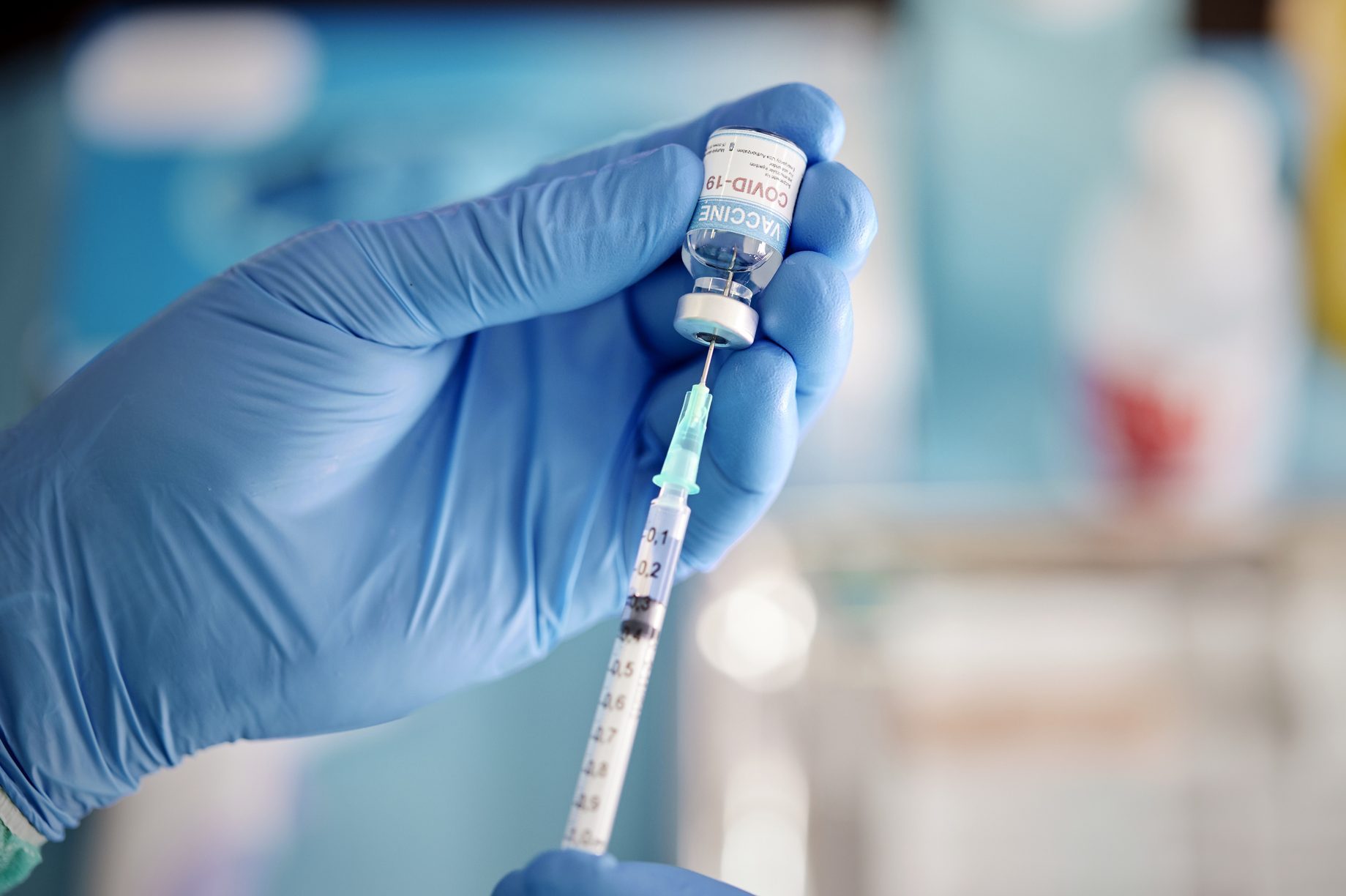 A Healthcare Worker Prepares a Dose of COVID-19 Vaccine.