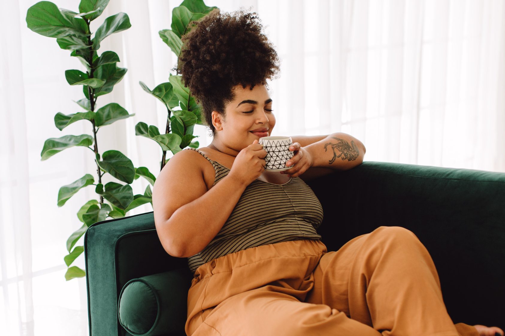 Healthy woman having coffee at home