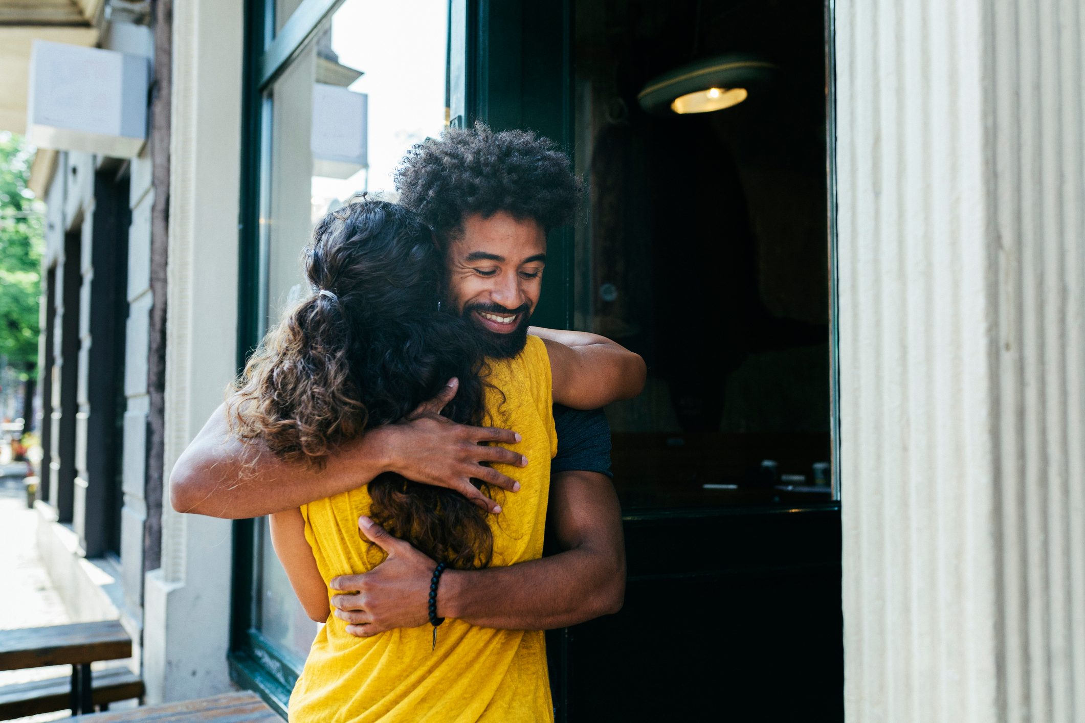 Friends Greeting Each Other Outside Restaurant