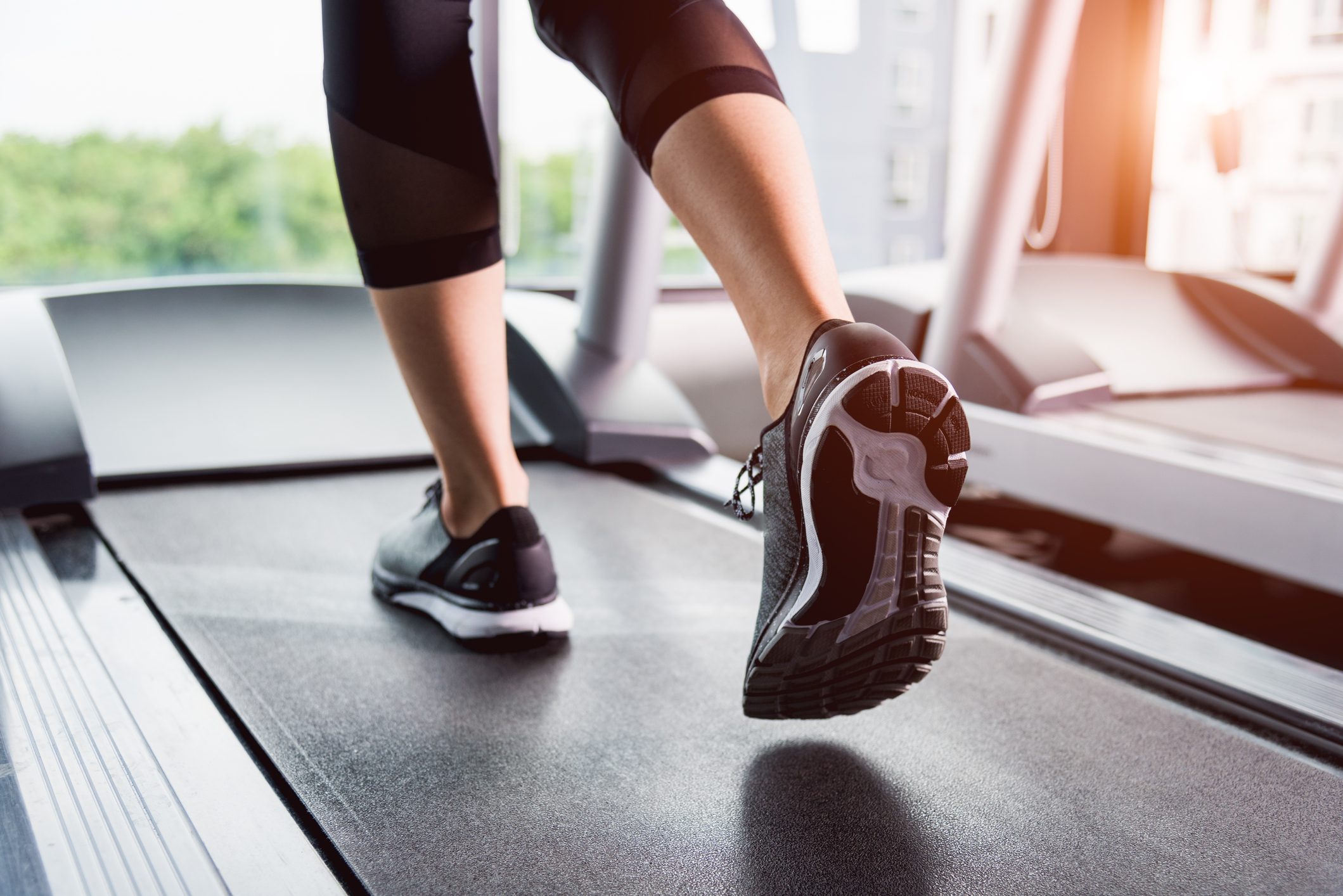 Woman running exercise on track treadmill