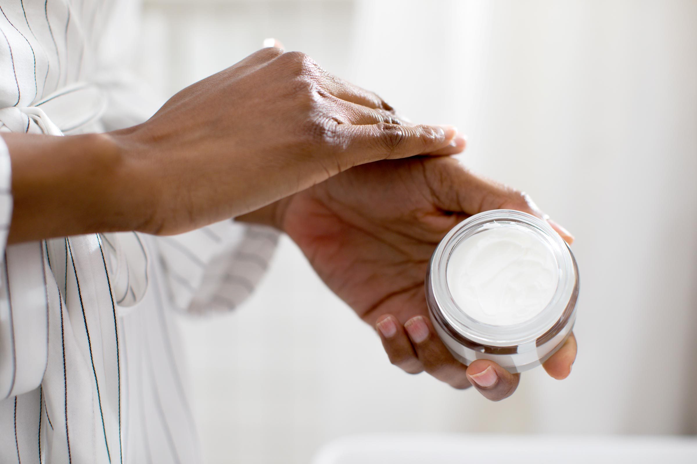 Woman Applying Hand Cream