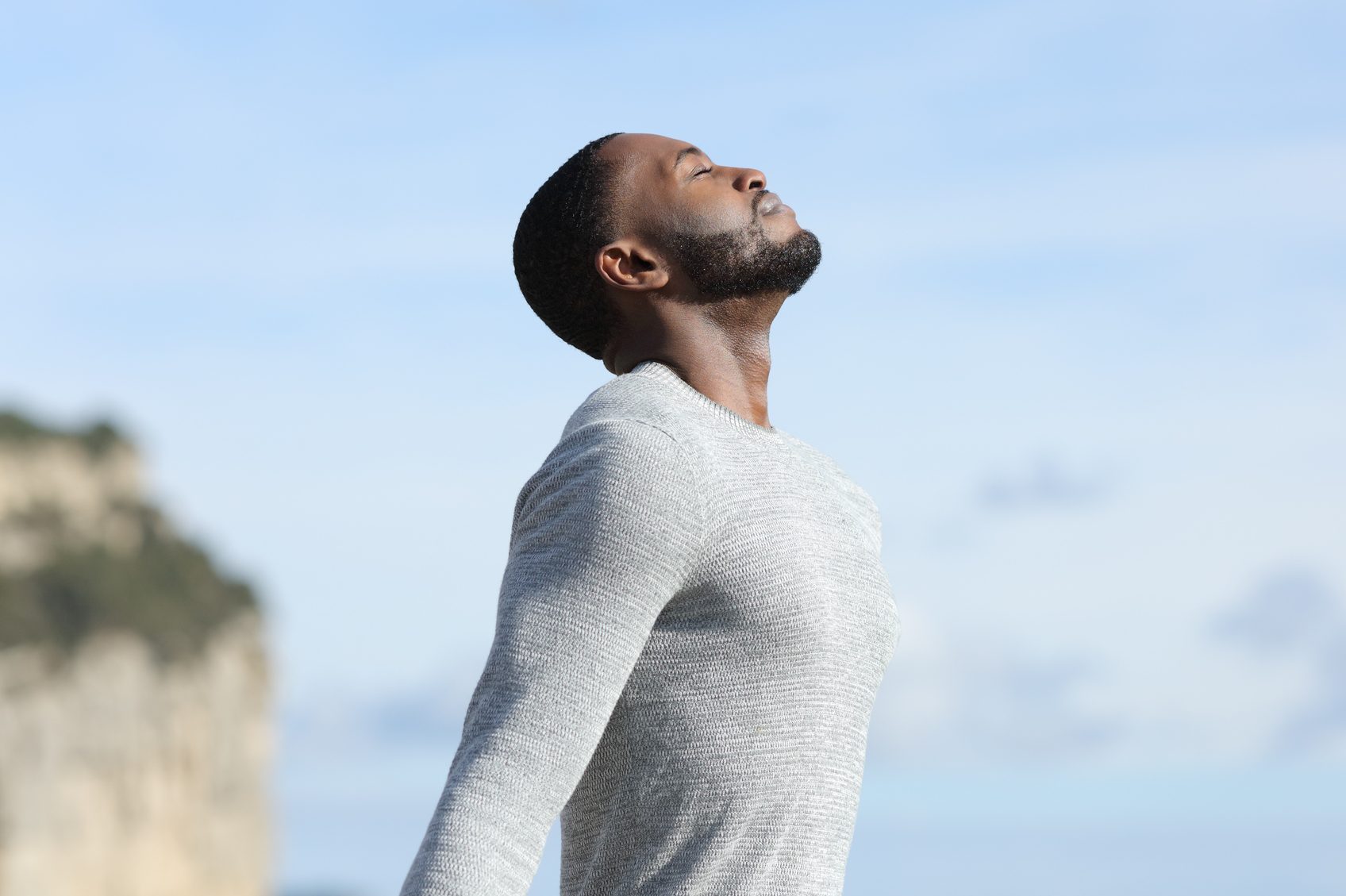Man with black skin relaxing breathing fresh air outside